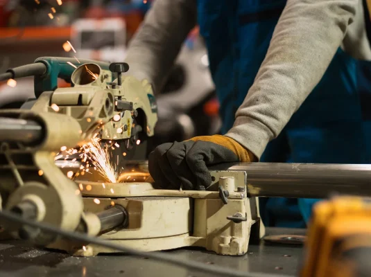 worker-working-with-circular-grinder-metal-with-sparks